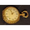 LADY'S POCKET WATCH - 18 K GOLD - ADORNED WITH FLORAL ENAMELS AND A DIAMOND - 23.62 g with mechanism